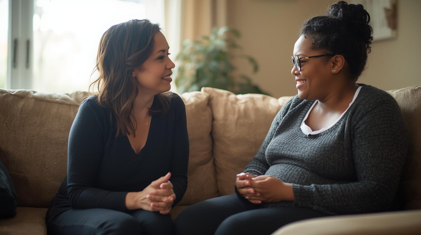 A parent and doula talking in a cozy home setting..jpg